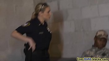 blond cop smashed by dark-hued guy